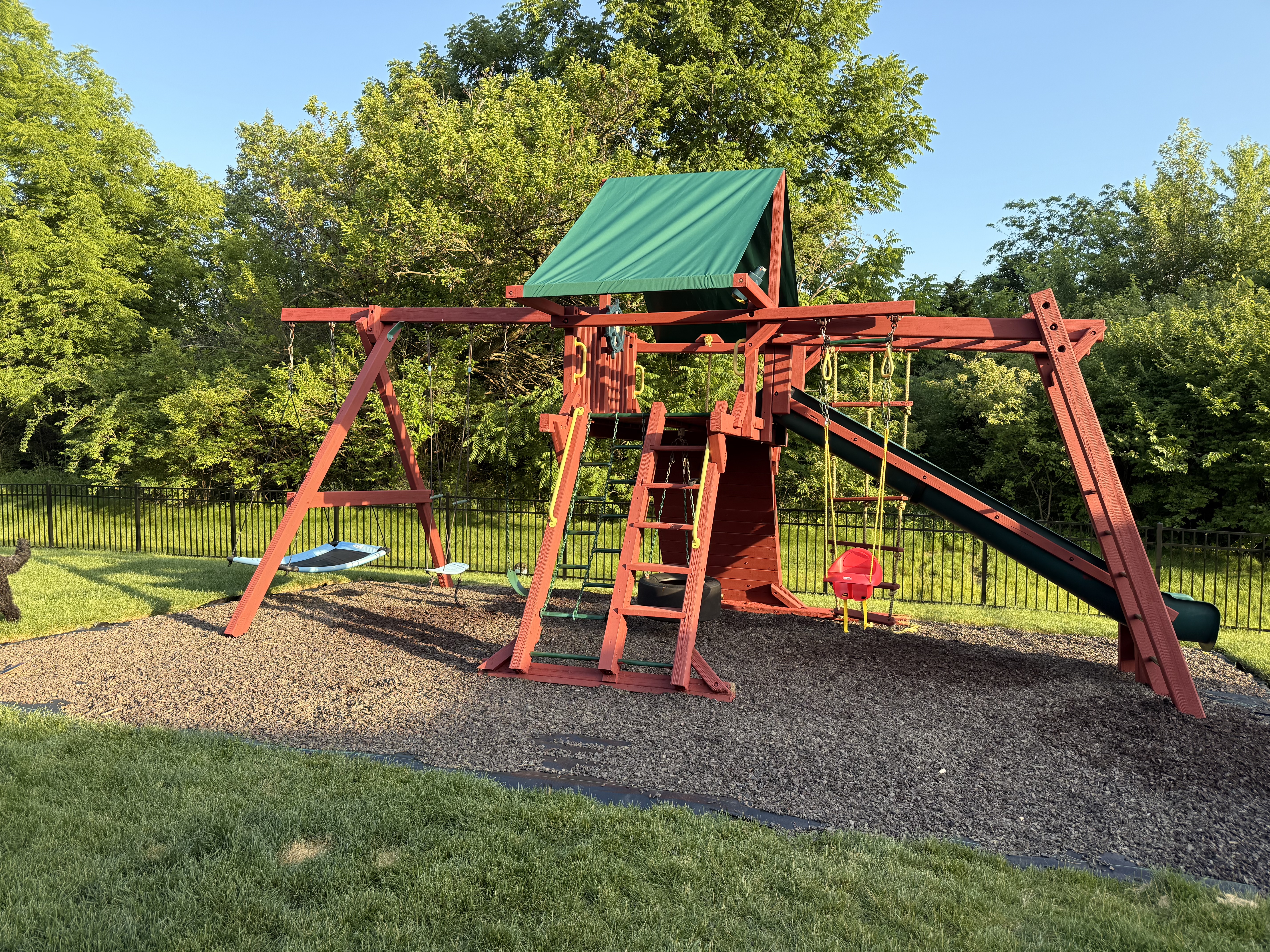 Finished playset with slide and swings